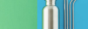 A metal water bottle and straws, showing an eco-friendly option for promotional materials